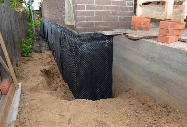 Happy homeowners after waterproofing job in Haslett